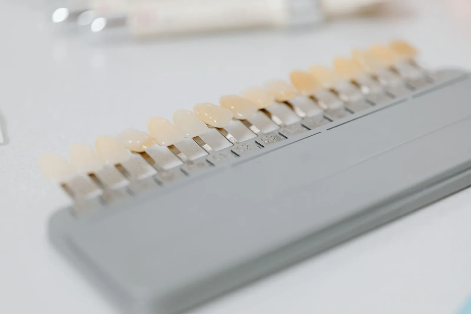Porcelain shade guide tabs laid out in a row