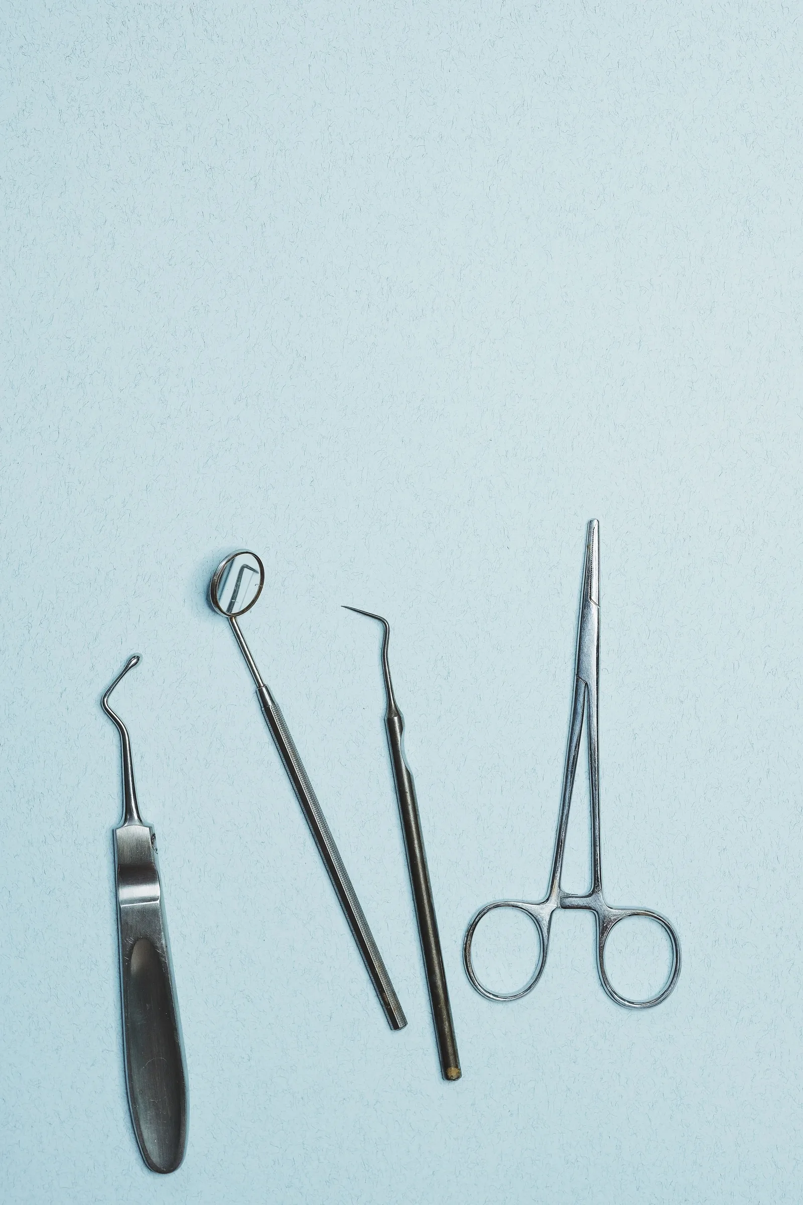 Dental instruments laid out on a tray