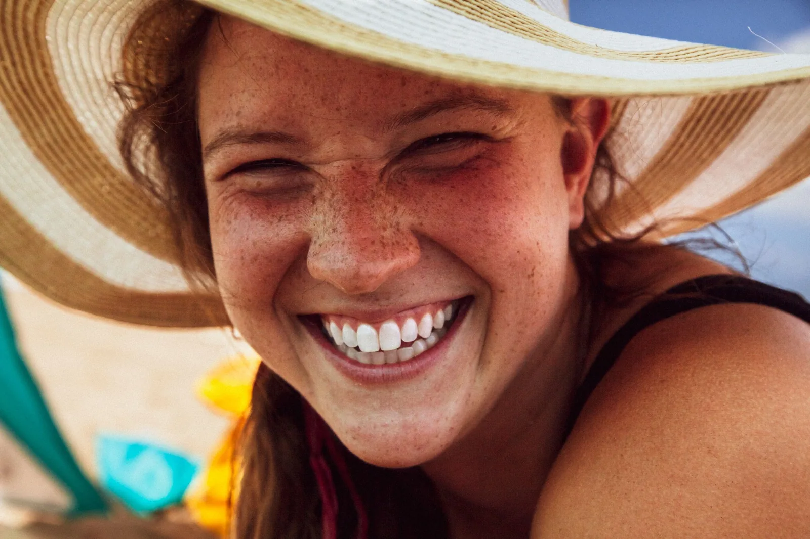 Close-up of a bright smile with freckles