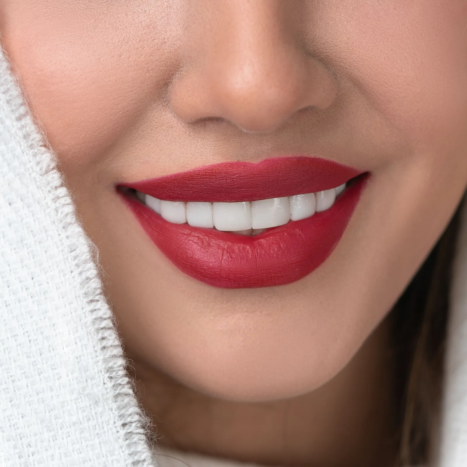 Close-up of a smile with red lipstick, after Bonding, two front teeth