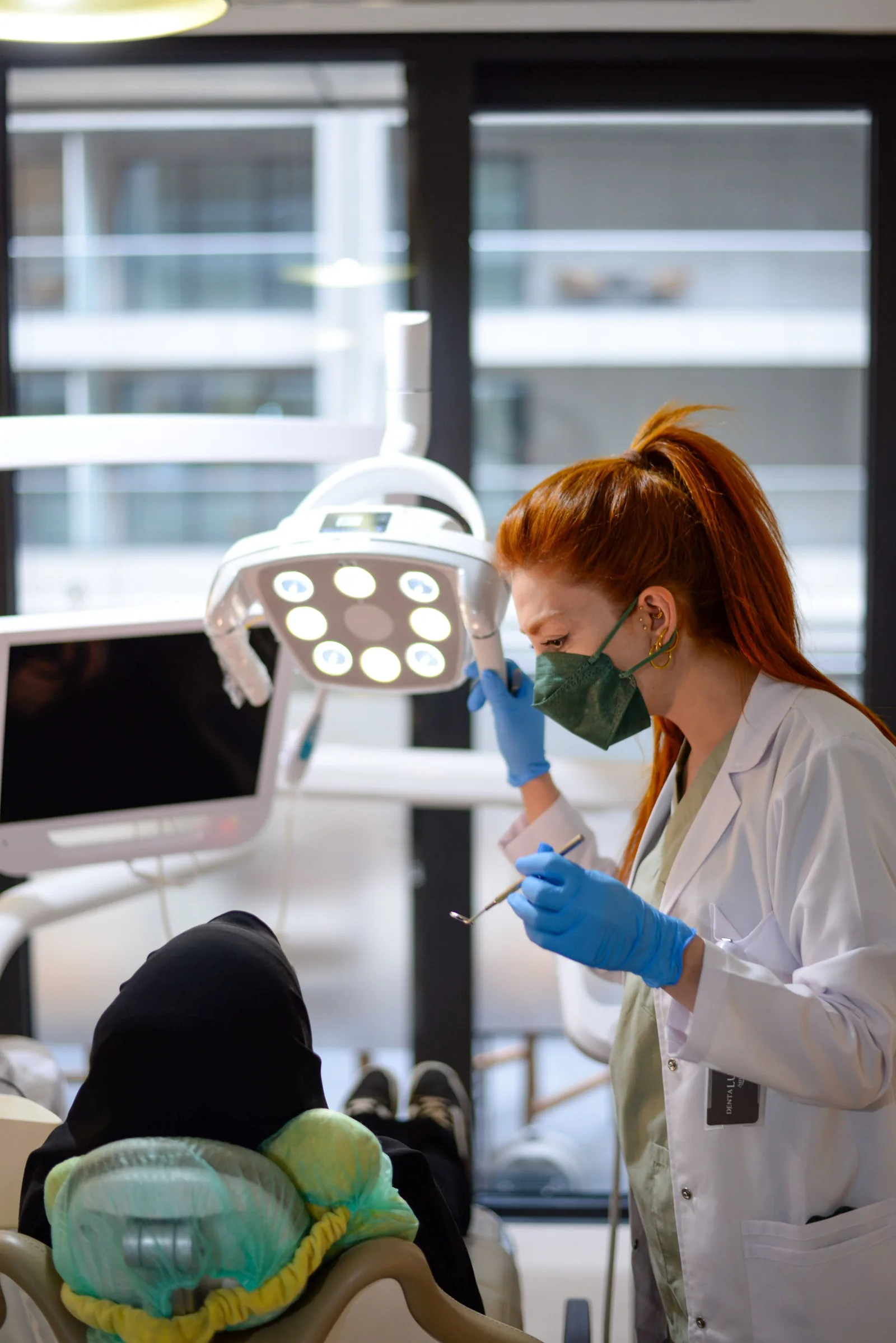 Dentist examining a patient in the chair